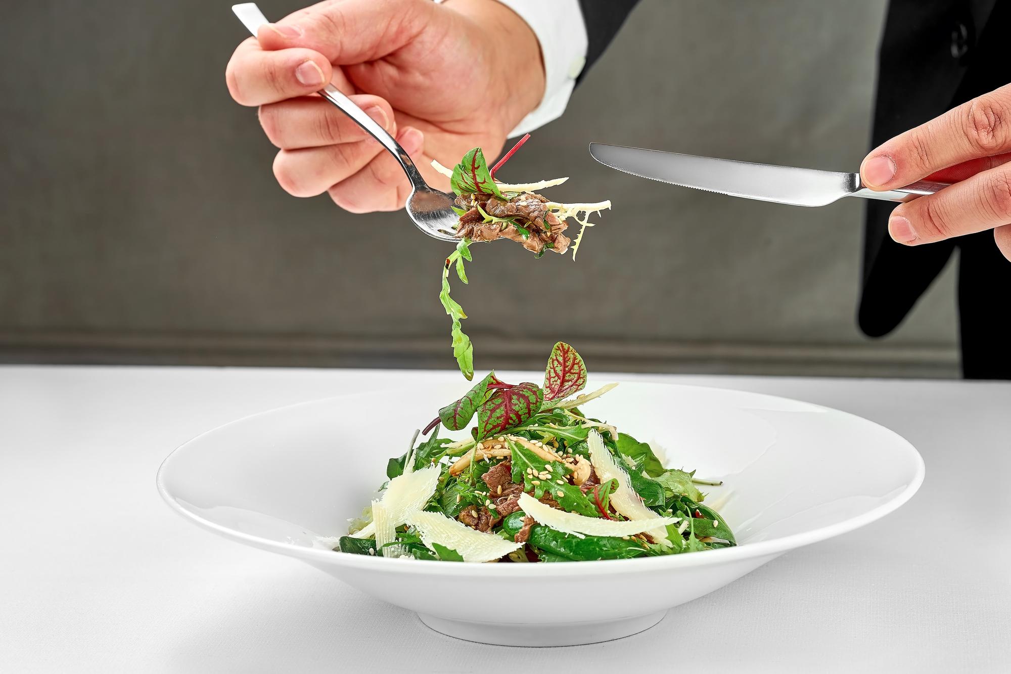 Chef plating a modern dish